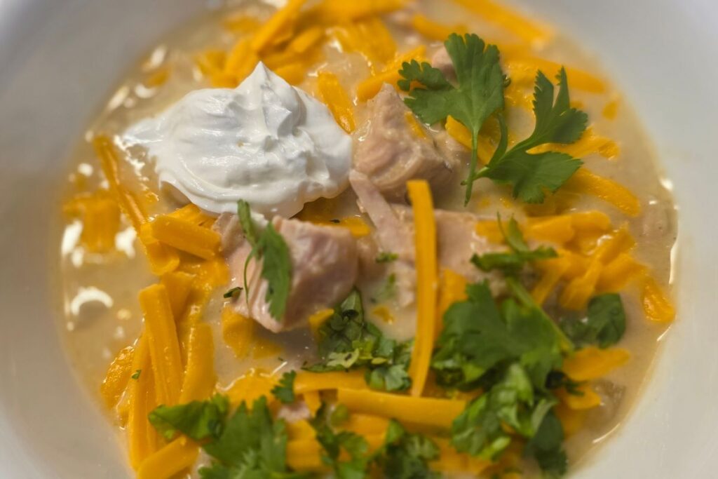 green chicken enchilada soup in a bowl 