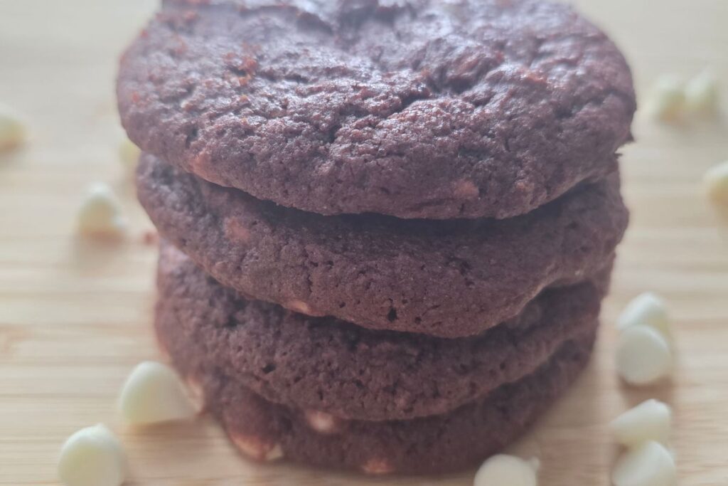 dye-free red velvet cookies on counter with white chocolate chips
