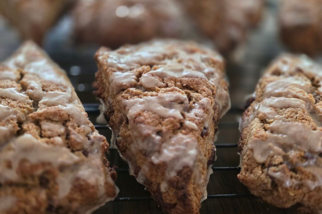 close up of a espresso chocolate chip scone on a rack