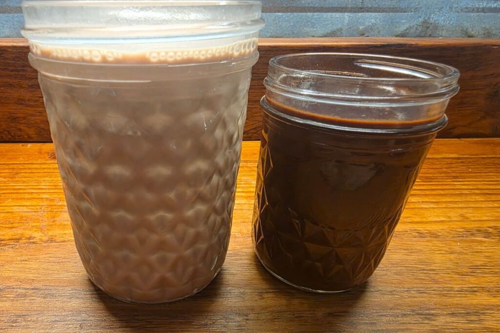 chocolate milk and homemade chocolate syrup in jars