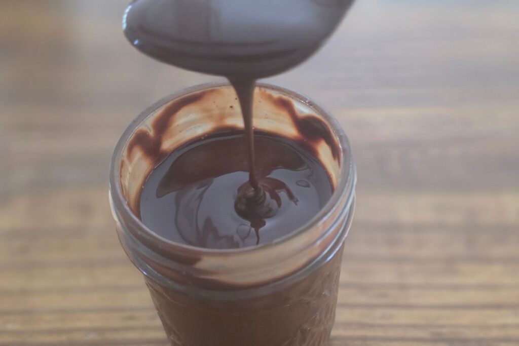 homemade chocolate syrup in a jar