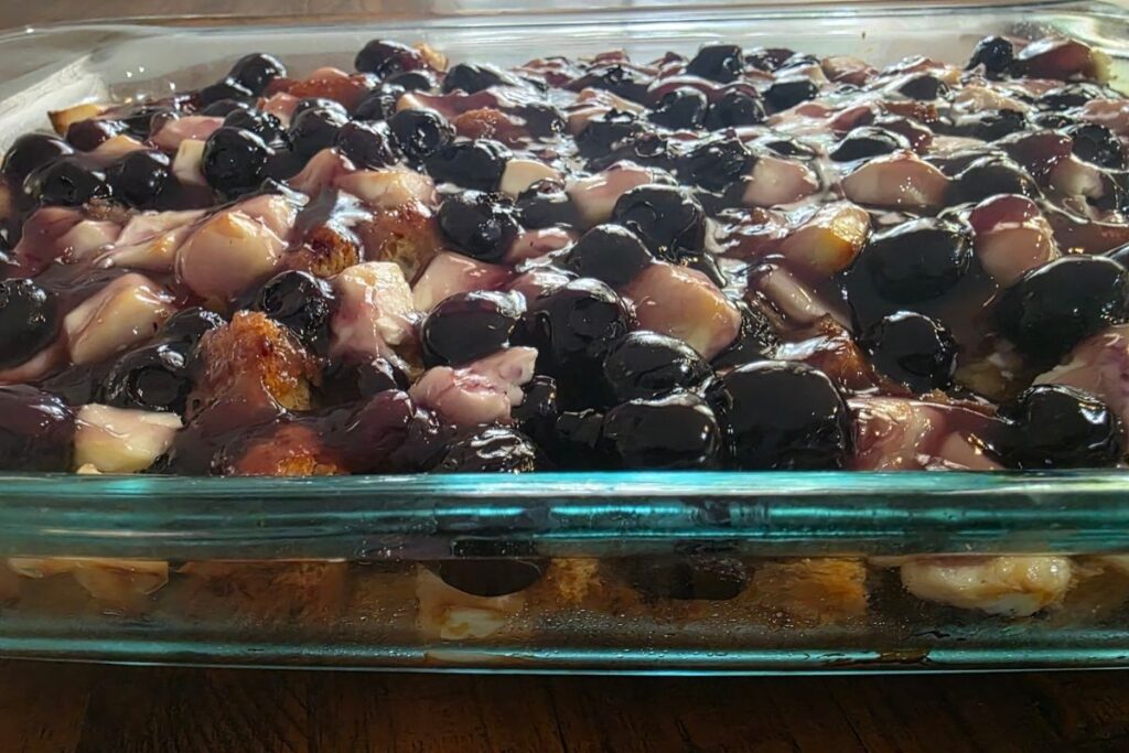 blueberry cream cheese french toast casserole with blueberry sauce